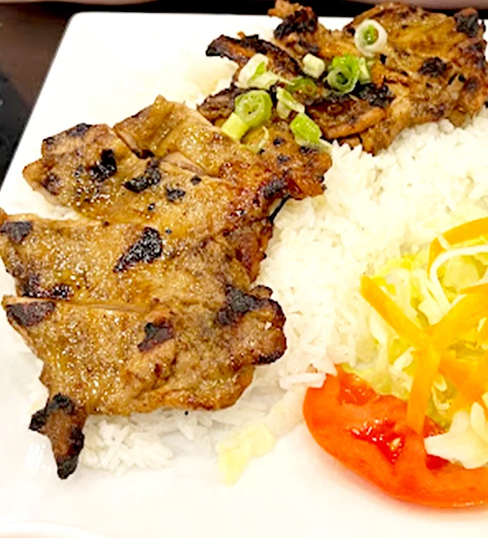 Grilled pork served over rice
